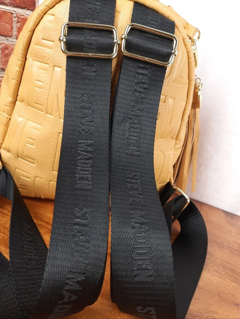 Steve Madden Mustard Mini Tassel Backpack